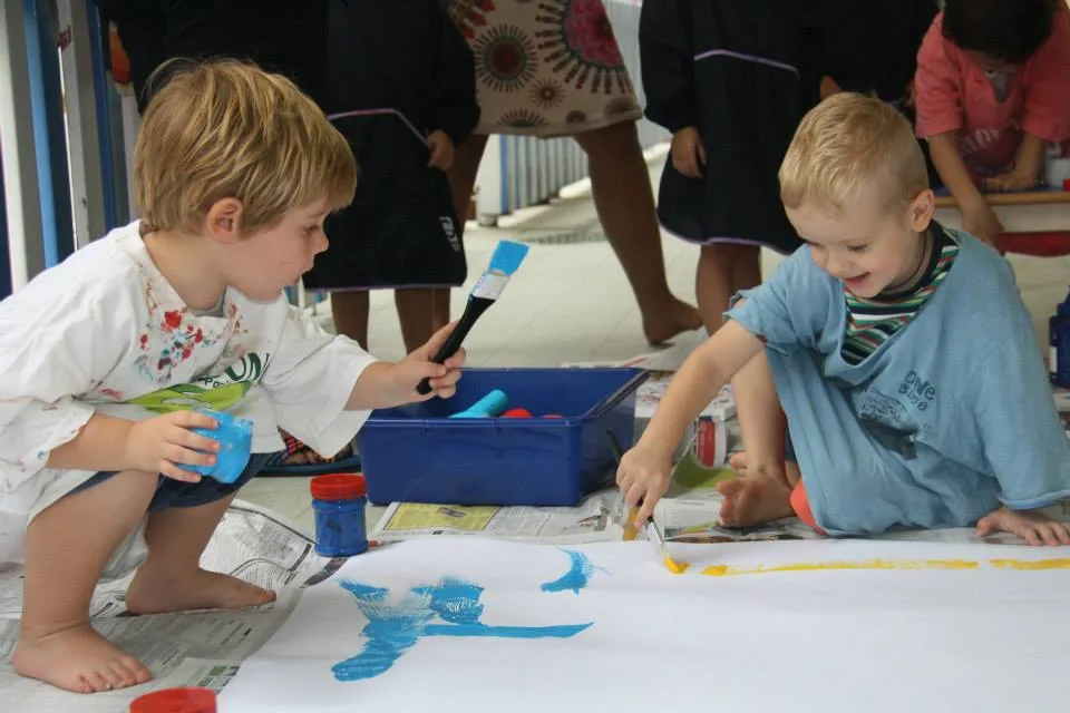 Children exploring collaborative art and painting at Pegasus